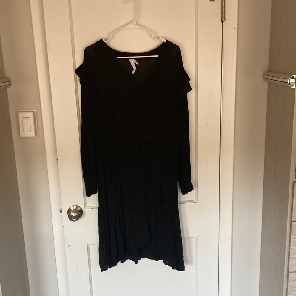 Black, long sleeve women’s dress.